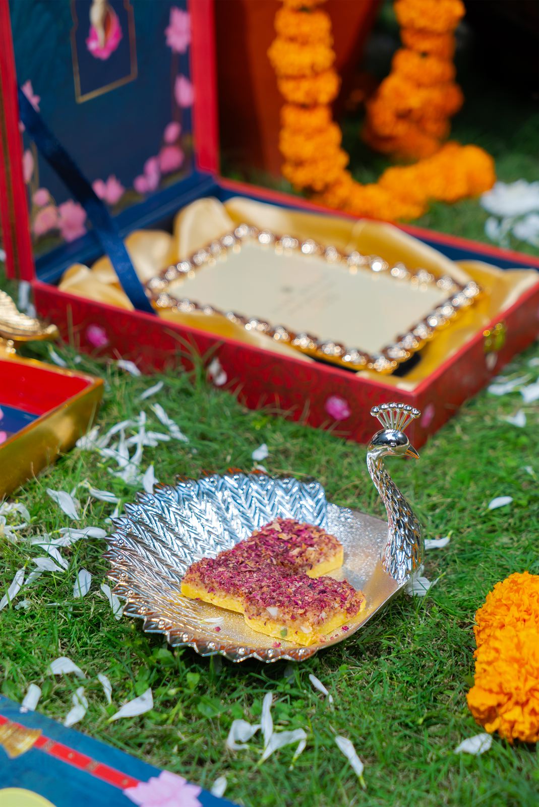 Wedding trousseau box on marigold-strewn grass