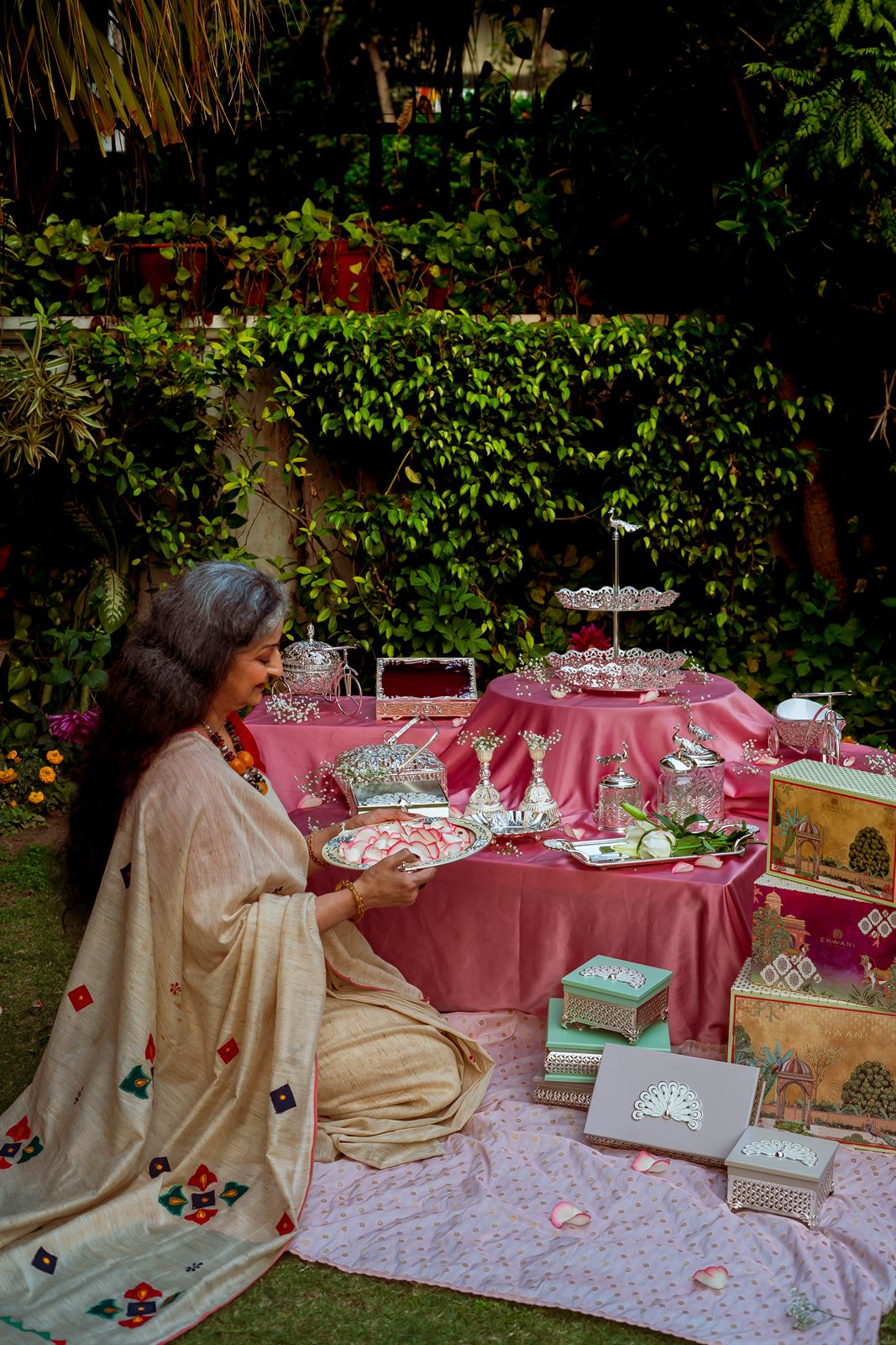 A matriarch arranging the Meethasa silver collection in a Delhi garden
